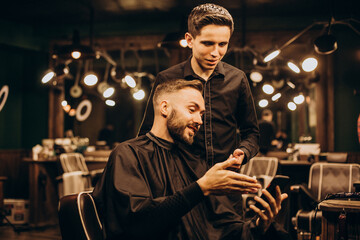 Young man at barbershop trimming hair