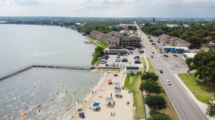 Top view City Beach Park in Granbury, Texas with long boardwalk and historical downtown in background