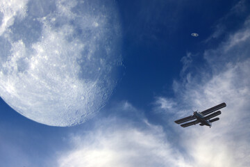Moon, Saturn and little airplane. Human and Universe concept