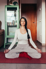Beautiful caucasian woman in a variety of yoga postures and meditation at home. Spiritual millennial girl practicing some yoga, meditation, exercise. Healthy lifestyle concept.