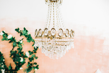 Beautiful hanging chandelier in the bedroom, close-up.