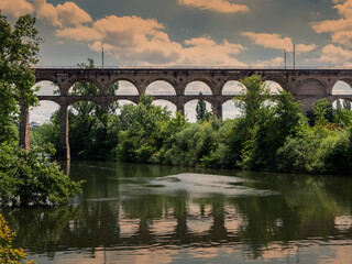 View of the Bietigheim railroad viaduct on a summer day with cloudy sky.