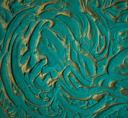 beautiful turquoise background with gold pattern close-up