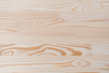 Soft blurred background of coniferous furniture board, pine.