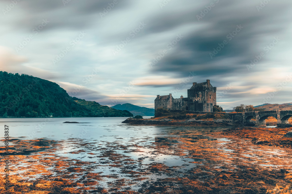Canvas Prints ancient historic eilean donan castle in the western highlands of scotland under a cloudy sunset sky - Canvas Prints