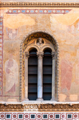 Decorated window of medieval building in Rome