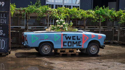 Trabant as welcome door sign in Berlin.
