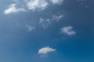 The clear blue sky had white clouds at midday. Use as background, poster