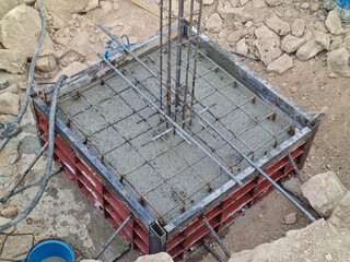 Concrete in a steel form poured concrete in the building construction area on the mountain