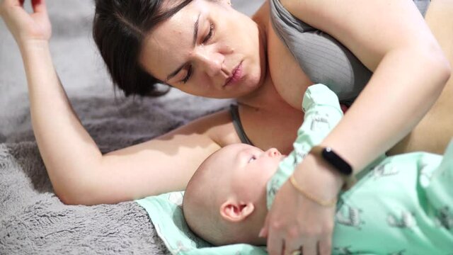 Breastfeeding baby. Young mother breastfeeding little baby.