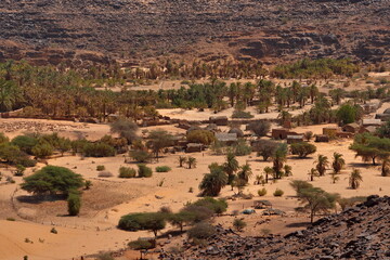 Mhaireth. Mauritania. October 05, 2021. View from the Adrar plateau to an oasis in the valley of a dried-up river in the Southwest of the Sahara Desert.