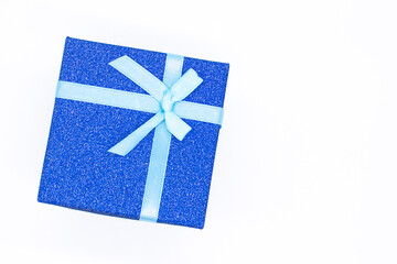 Christmas gift box with a ribbon for congratulations on white background. Gift box for Christmas, New Year or Valentine's Day