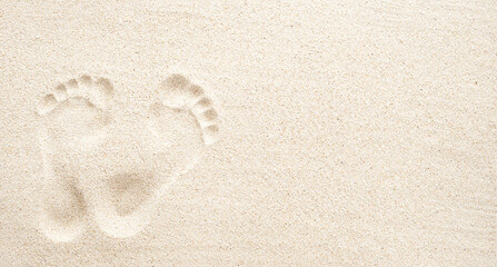 Texture background, Footprints of human feet on the sand, top view with copy space