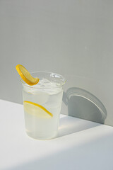Glass of fresh lemonade on white background.
