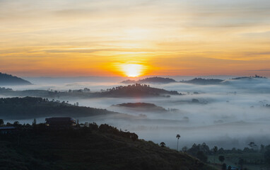 Morning mountain view with sea of fog and sunrise sky.