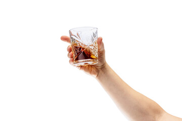 Cropped image of male hand holding glass with whiskey or rum isolated over white background