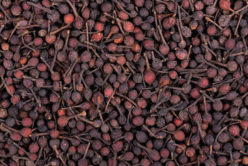 Bourbon pepper background. Voatsiperifery or bourbonese piper. Madagascar pepper. Top view.