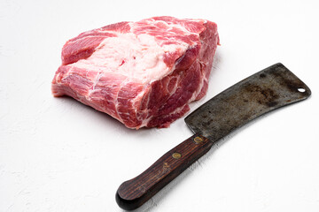 Pork Neck meat steak , with old butcher cleaver knife, on white stone table background