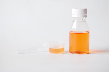 liquid medicine in a container on white background 