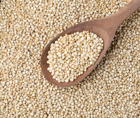 Closeup, top view of raw quinoa grains. Food backdrop