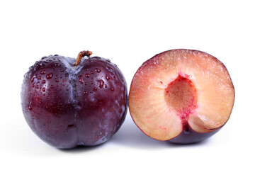 Blue plum and a half of a plum