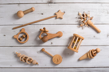 Handcrafted wooden train on an beige carpet, retro toned image. wooden toys, eco-friendly toys, toys for children made of wood