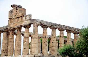 Fototapeta na wymiar Temple of Athena-Paestum, an ancient city of Magna Graecia called by the Greeks Poseidonia in honor of Poseidon, but very devoted to Athena and Hera. Under the Romans it takes the name of Paestum