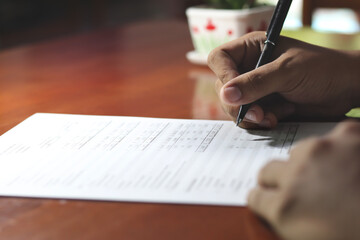 Businessman signing important document