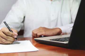Businessman signing important document