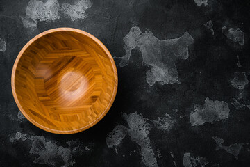 Empty Wooden Bowl with copy space for text or food, top view flat lay , on black dark stone table background