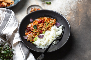 chicken stir fry with with tomato sauce, maple syrup and rice