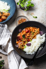 chicken stir fry with with tomato sauce, maple syrup and rice