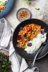 chicken stir fry with with tomato sauce, maple syrup and rice