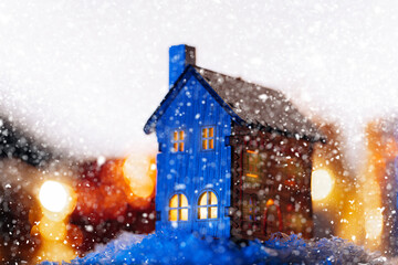 Fototapeta premium christmas at home. house in the winter forest. concept of celebrating christmas at home with family.