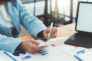 Close up of accountant or banker checking investment results, calculates financial savings,...