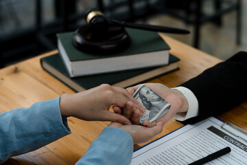 Fototapeta premium lawyer taking dollar bribe from the female client for falsifying documents, businessman taking bribes corruption illegal fraud bribery concept.