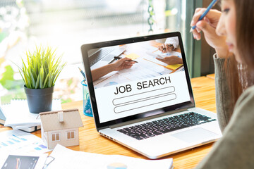 laptop with job search engine on screen in modern office.