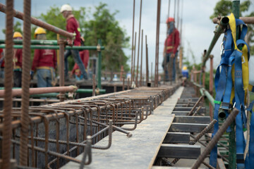 Naklejka premium Steel bars to form on the black wood floor, rust red in the building construction area.