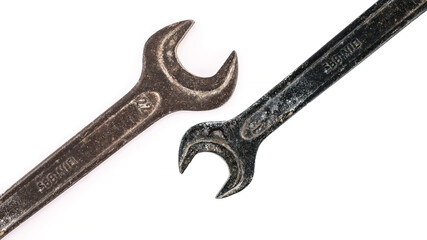 Two old mechanical wrenches in a strong sense