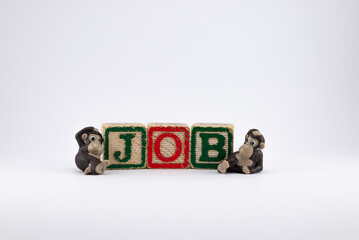 Icons of two monkeys next to wooden cubes symbolizing job