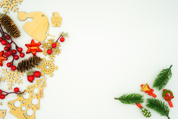 christmas layout with wooden toys, snowflakes, christmas tree, santa hat, pine cone