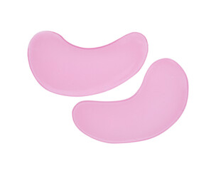 Pink under eye patches on white background, top view. Cosmetic product