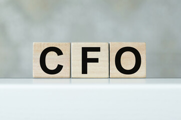 cubes with the word CFO on table, business concept