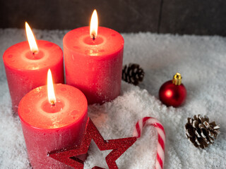 Red Christmas candle and Christmas decorations.