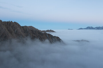 sunset in the mountains with clouds