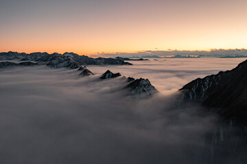 sunset in the mountains with clouds