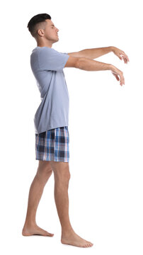 Somnambulist in pajamas on white background. Sleepwalking