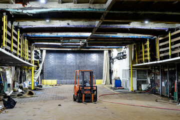 excavator in Qaboos port. focus on excavator's wheel