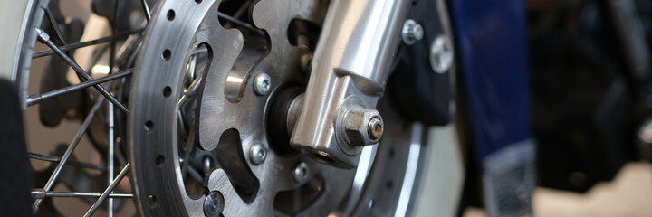 Closeup of brake disc on motorcycle wheel