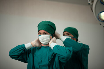 surgeon doctor team working in operation room at hospital, medical health clinic with specialist